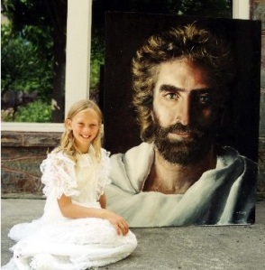 Akiane, age 8, with her painting of Jesus